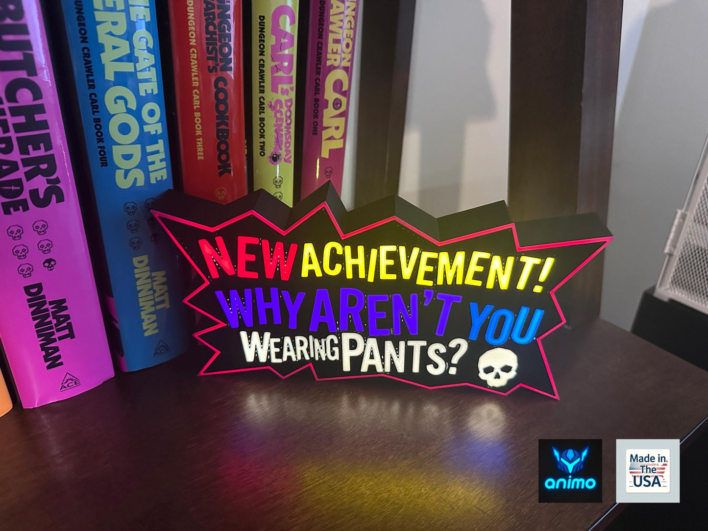 Dungeon Crawler Carl 3D Printed Lightbox – "New Achievement: Why Aren’t You Wearing Pants?" LED Sign – LitRPG DCC Fan Gift – Dimmable Lamp